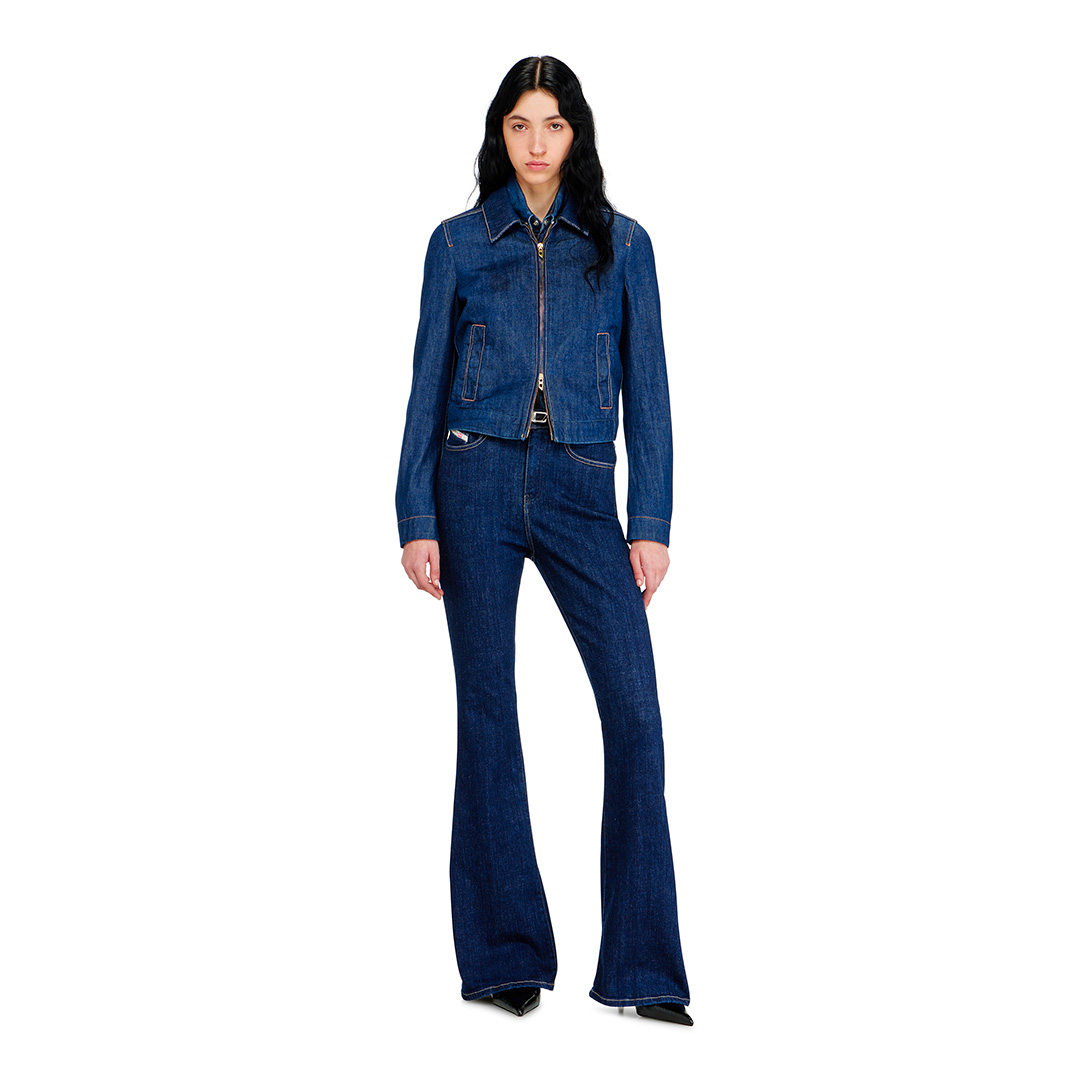 A woman wearing a pair of high-waisted jeans from Diesel